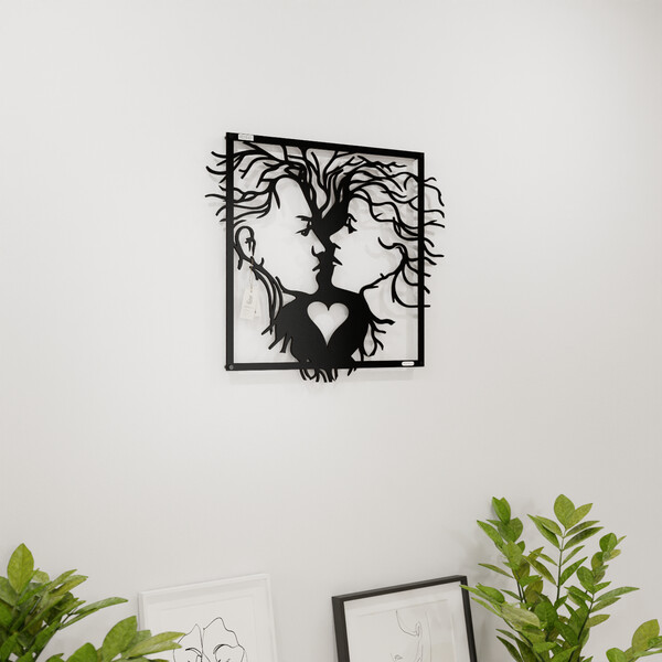 3000938 pięknie wycięte laserem Panel ażurowy 3d twarze  na białej ścianie z czarnej płyty