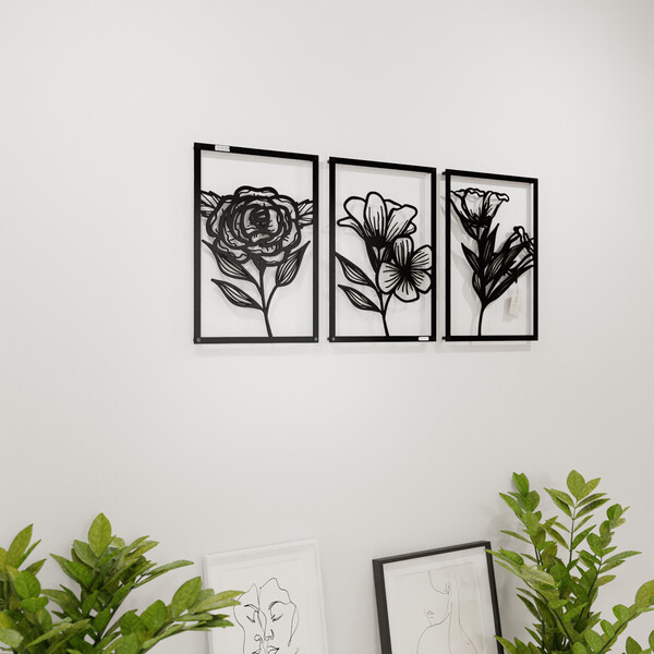 3000954 pięknie wycięte laserem Tryptyk z kwiatami trzy panele ścienne  na białej ścianie z czarnej płyty
