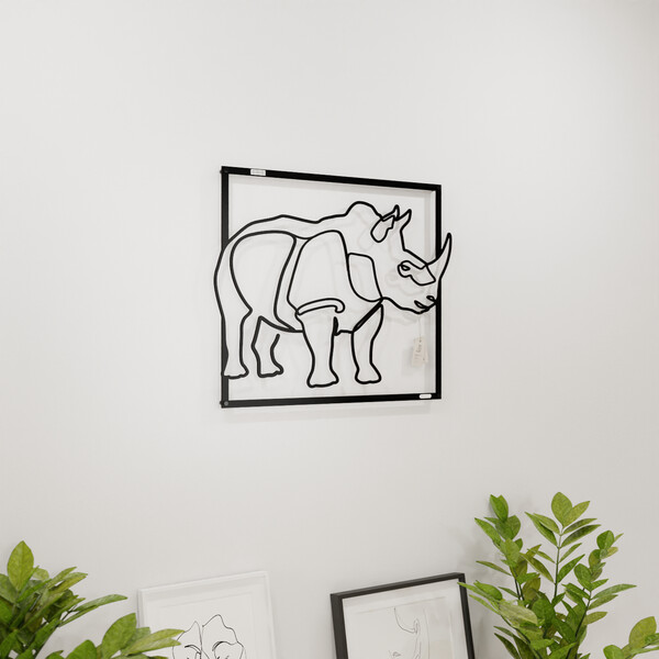 3001065 pięknie wycięte laserem Panel dekoracyjny nosorożec  na białej ścianie z czarnej płyty